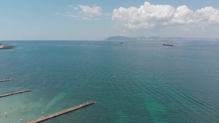 Aerial photography of the sea with boats and mountains