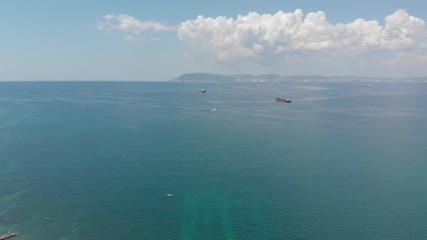 Aerial photography of the sea with boats and mountains
