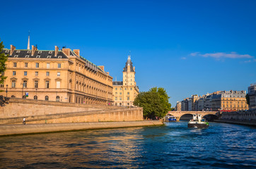 Fototapeta na wymiar Sunset view on bridge and buildings on the Seine river in Paris, France
