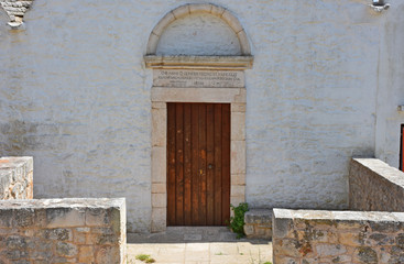 Fototapeta na wymiar Italy, Puglia region, Locorotondo, a whitewashed village in full Valle d'Itria, medieval historical center, architecture and details.