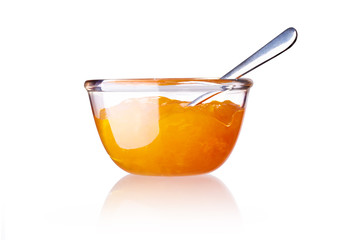 a glass of jam , isolated on white
