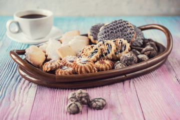Tasty different cakes set on a color gradient background