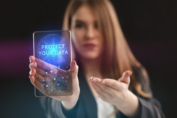 The concept of business, technology, the Internet and the network. A young entrepreneur working on a virtual screen of the future and sees the inscription: Protect your data
