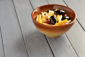 Cheese salad with grapes, apple and celery, copy space