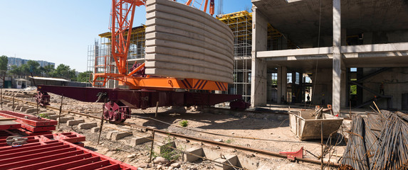 the lower part of the construction crane and concrete frame of the building