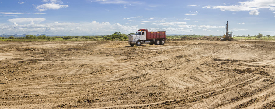 Trucks and heavy machinery clearing the land for the construction of a Solar Energy PV Plant at Choluteca, Honduras