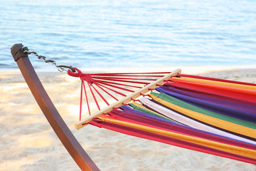 Fototapeta premium Colorful hammock at seaside. Time to relax