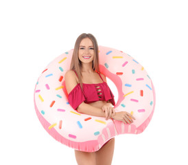 Obraz na płótnie Canvas Sexy young woman in bikini with inflatable ring on white background
