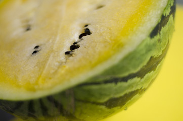 Yellow watermelon on the yellow background 