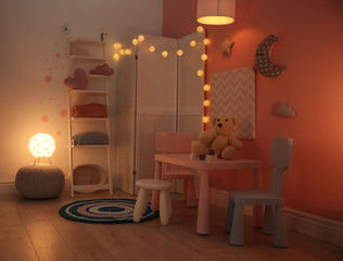 Modern child room interior with toys and decorations