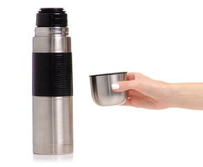 Thermos bottle metal in hand on white background isolation