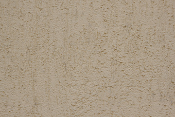 Brown plastered handmade rough wallpaper. Beautiful decorative gray plastered wall.