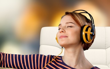 Young woman with headphones listening to music