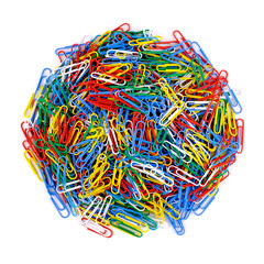 Pile of colored paper clips on isolated white background. Close up view.