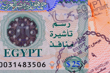 Part photo of Egypt visa with stamp in passport. Visa fee in Egypt $25. Close up view.