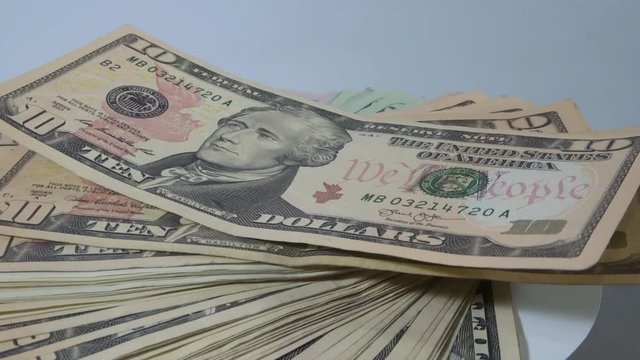 Rotating a pack of 10 dollar bills