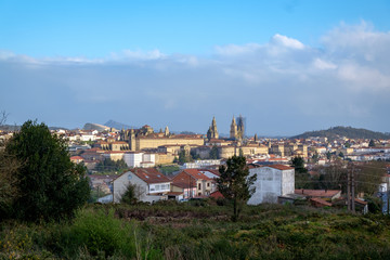 Fototapeta na wymiar View from hill to the Santiago de Compostela, spanish city in Galicia. Cathedral of Santiago de Compostela under reconstruction.
