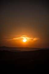 Fototapeta premium Red sky with clouds during sunset. Sun is very nearby Earth.