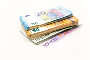 Pile of Euro Banknotes, isolated close-up on white background