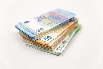 Pile of Euro Banknotes, isolated close-up on white background