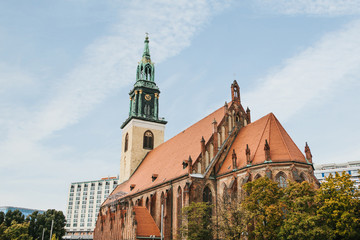 The Church of St. Mary in Berlin in Germany on the Alexanderplatz square against the blue sky in autumn.