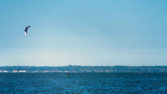 Kitesurfen on a beautiful blue ocean