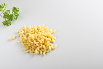 pasta elbows on a light background
