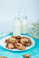 Cookie chocolate with a milk bottles.