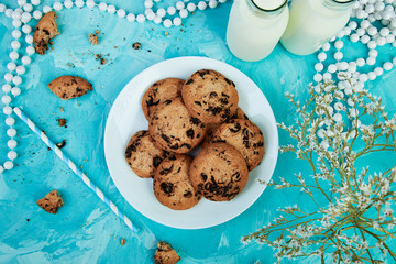 Cookie chocolate with a milk bottles.