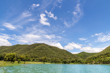Scenery of mountain landscape with lake and sky,Beautiful the reservoir water and green mountain with blue sky and clouds beauty in Thailand