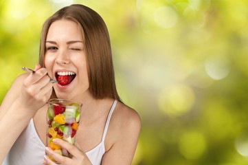 Attractive caucasian woman with fruit salad