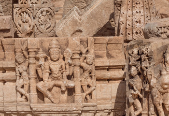 Carved broken walls of Hindu temples with sculptures of Shiva lord and other, Chitaurgarh fort. Rajasthan of India.