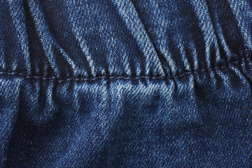 Naklejka premium Blue jeans background. jeans texture. close up