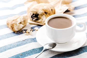 Cappuccino on a striped tablecloth. Morning coffee.