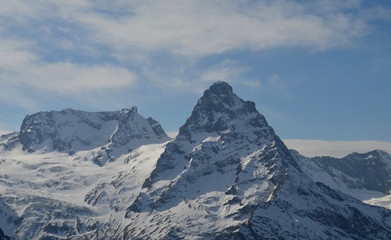 Snow covered Greater Caucasus mountains at winter sunny day