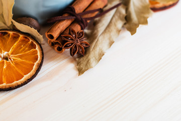 Autumn, fall leaves, hot steaming cup of glint wine