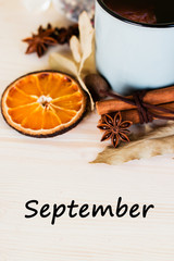 Fototapeta premium Autumn, fall leaves, hot steaming cup of glint wine