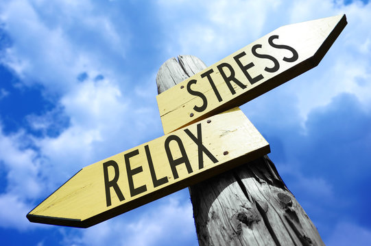 Stress, relax - wooden signpost