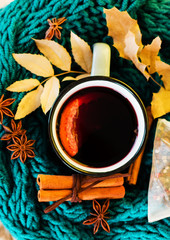Autumn, fall leaves, hot steaming cup of glint wine