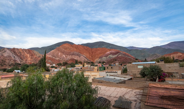 Panoramic view of Purmamarca town with the Hill of Seven Colors (Cerro de los siete colores) on background  - Purmamarca, Jujuy, Argentina