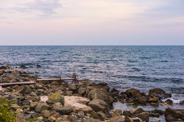 Small bridge by the sea, sunset