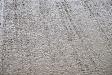 Wet, freshly poured and leveled concrete