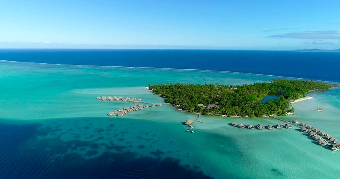 Water bungalows resort at islands, french polynesia in aerial view