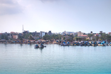 Fishing boats on the shore of the Vasco de Gama Port in Goa, India.