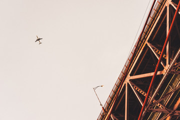 25 de Abril Bridge in Lissabon, Portugal with airplane