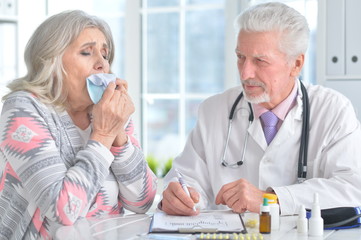Senior doctor with elderly patient