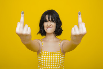 Young woman showing middle finger