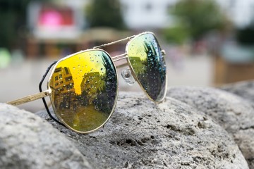 Sunglasses in town during rain. Slovakia