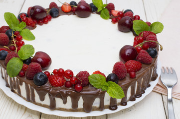 Sweet Cake with fresh berries on wooden background. Top view