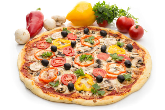 Delicious italian pizzas on white background. Pizza with ham, pepper and olives